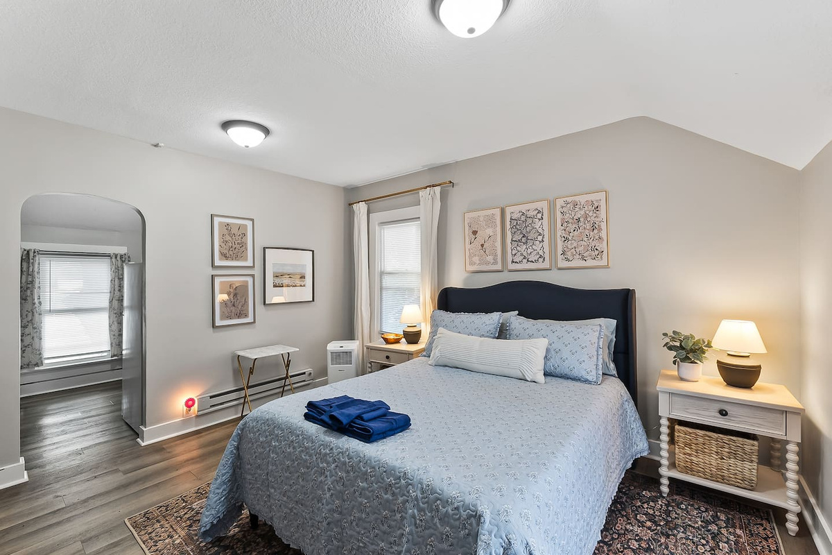 Plenty of natural light and easy flow make this bedroom a relaxing home base for your stay.