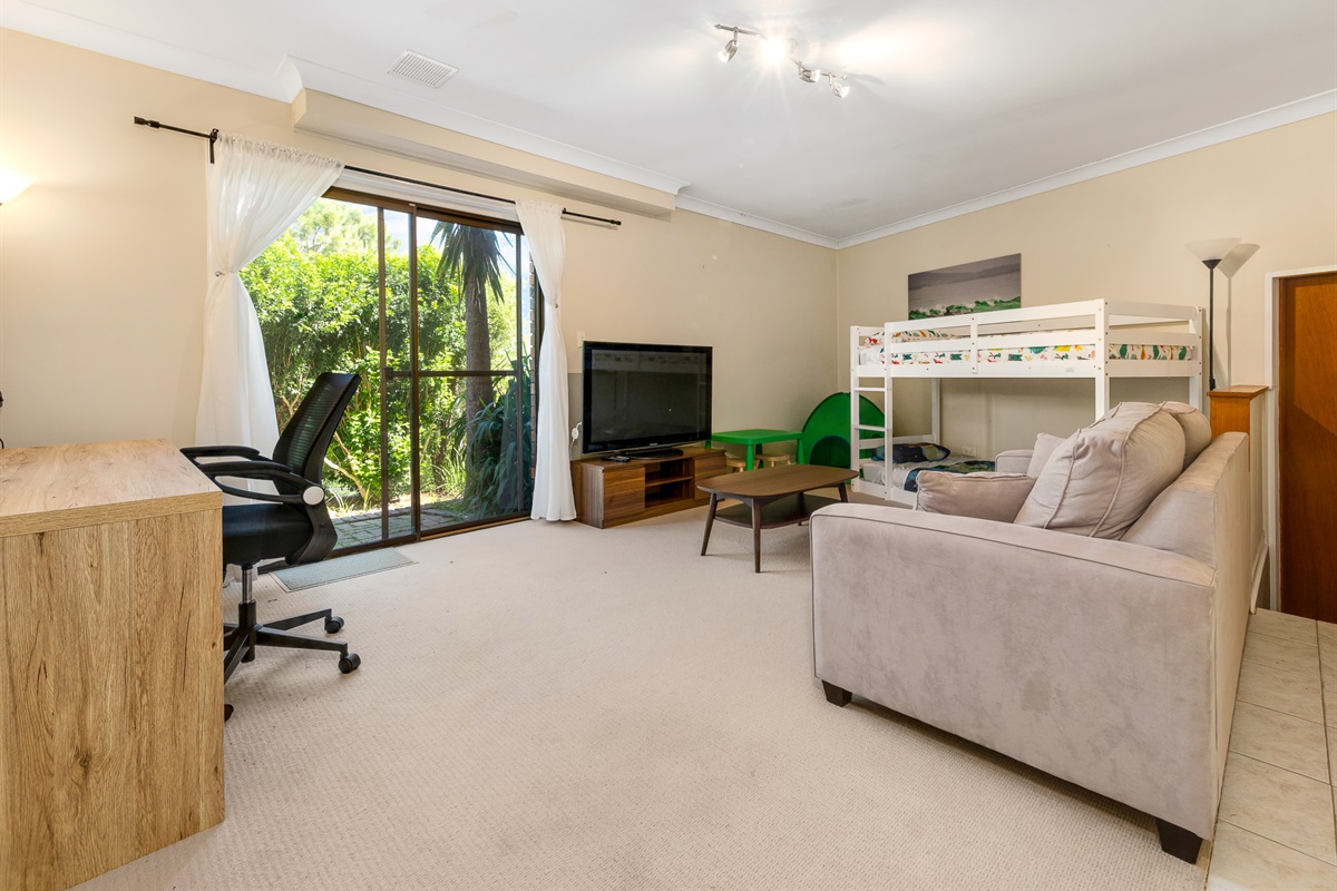The bunk room doubles as a downstairs rumpus space, adding a flexible lower-level zone to Bertie’s 3 Beaches.