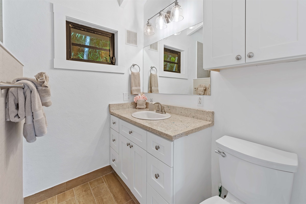 Shared bathroom right between the two bedrooms comes with all the essentials