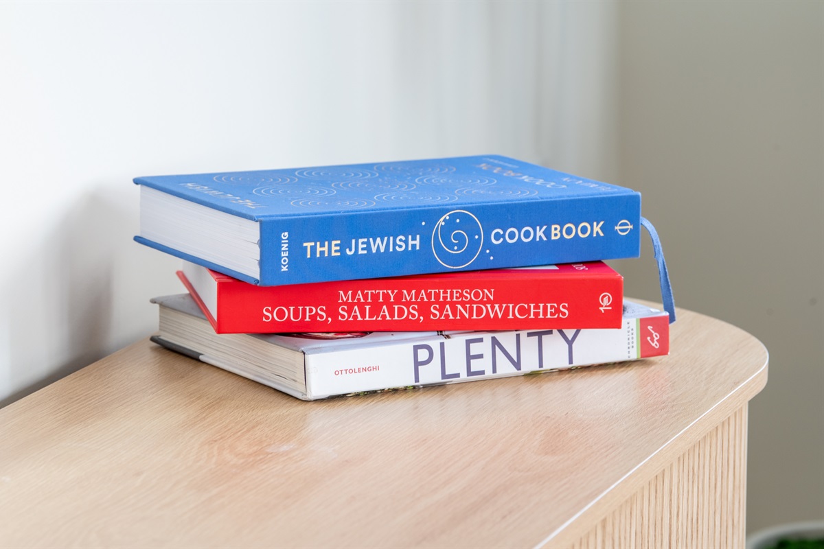 Touch of personality—stack of colorful cookbooks for added charm