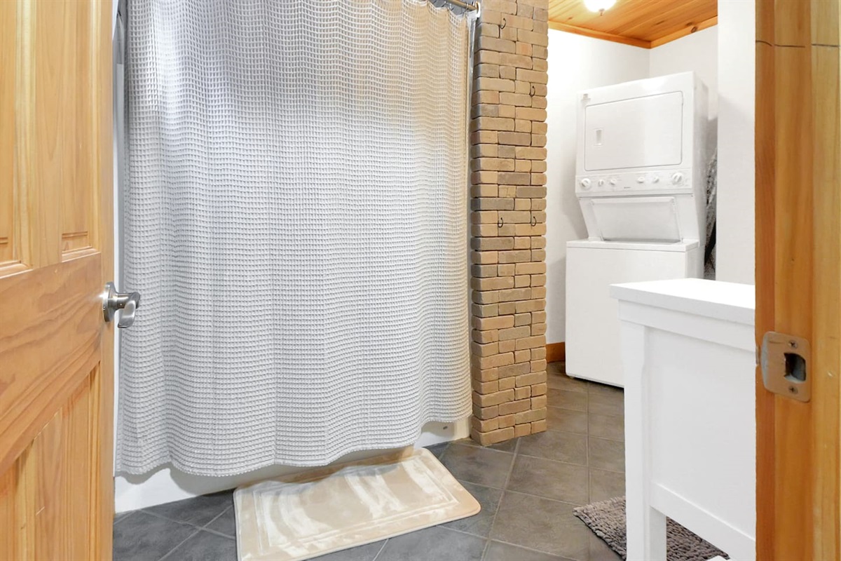 This bathroom is on the first level of the home, equip with full shower and stand up washer/dryer! 