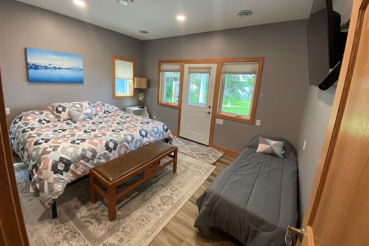 Master bedroom with a twin with walkout to patio area 