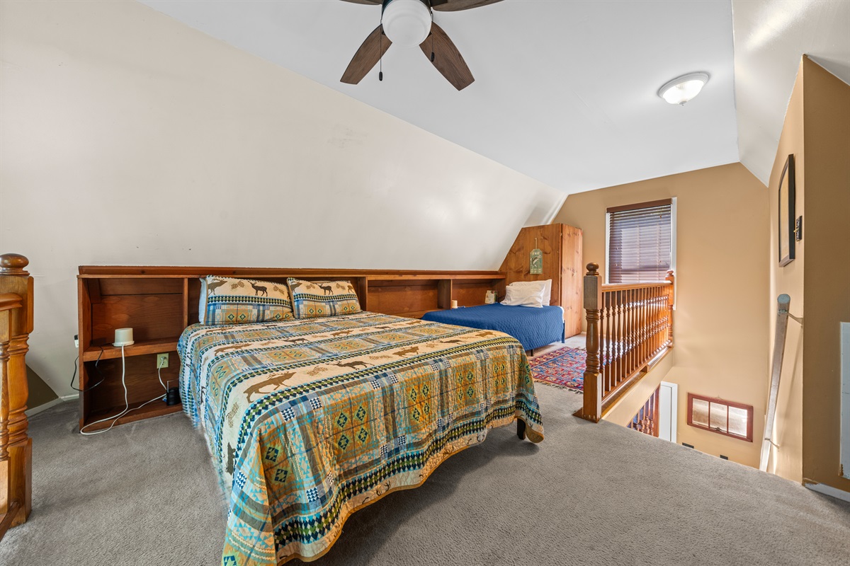 Sleeping loft with queen and twin XL platform beds.