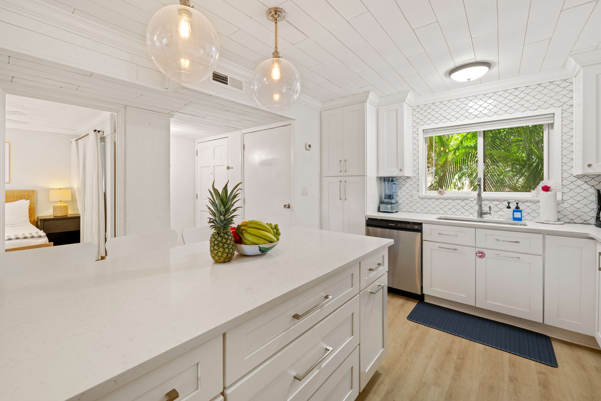 A welcoming kitchen island&mdash;perfect for coffee, cocktails, or conversation.