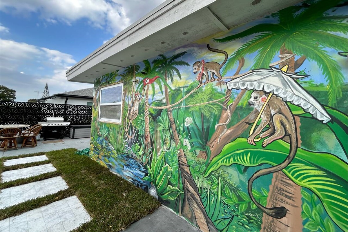 Completed in 2023 by a local artist, this unique, custom mural features a tropical paradise galore.