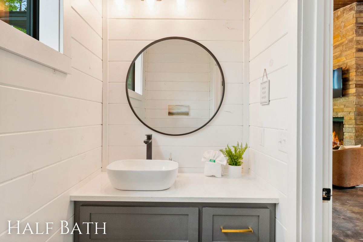 Freshen up in a bathroom that combines clean lines and modern design with the warmth of rustic elements for a serene retreat.
