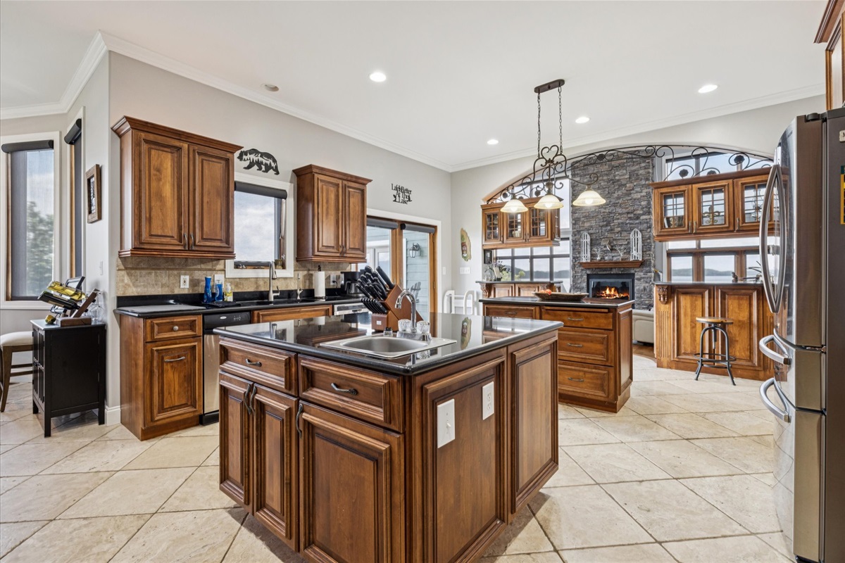 Looking Forward to Massive Kitchen with 2 sinks, an eating area, and large pantry
