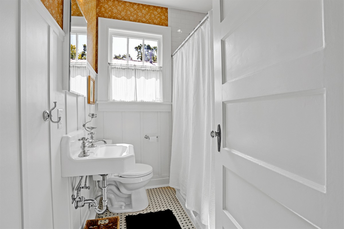 A perfect blend of classic style and modern amenities makes this full bath both functional and inviting.