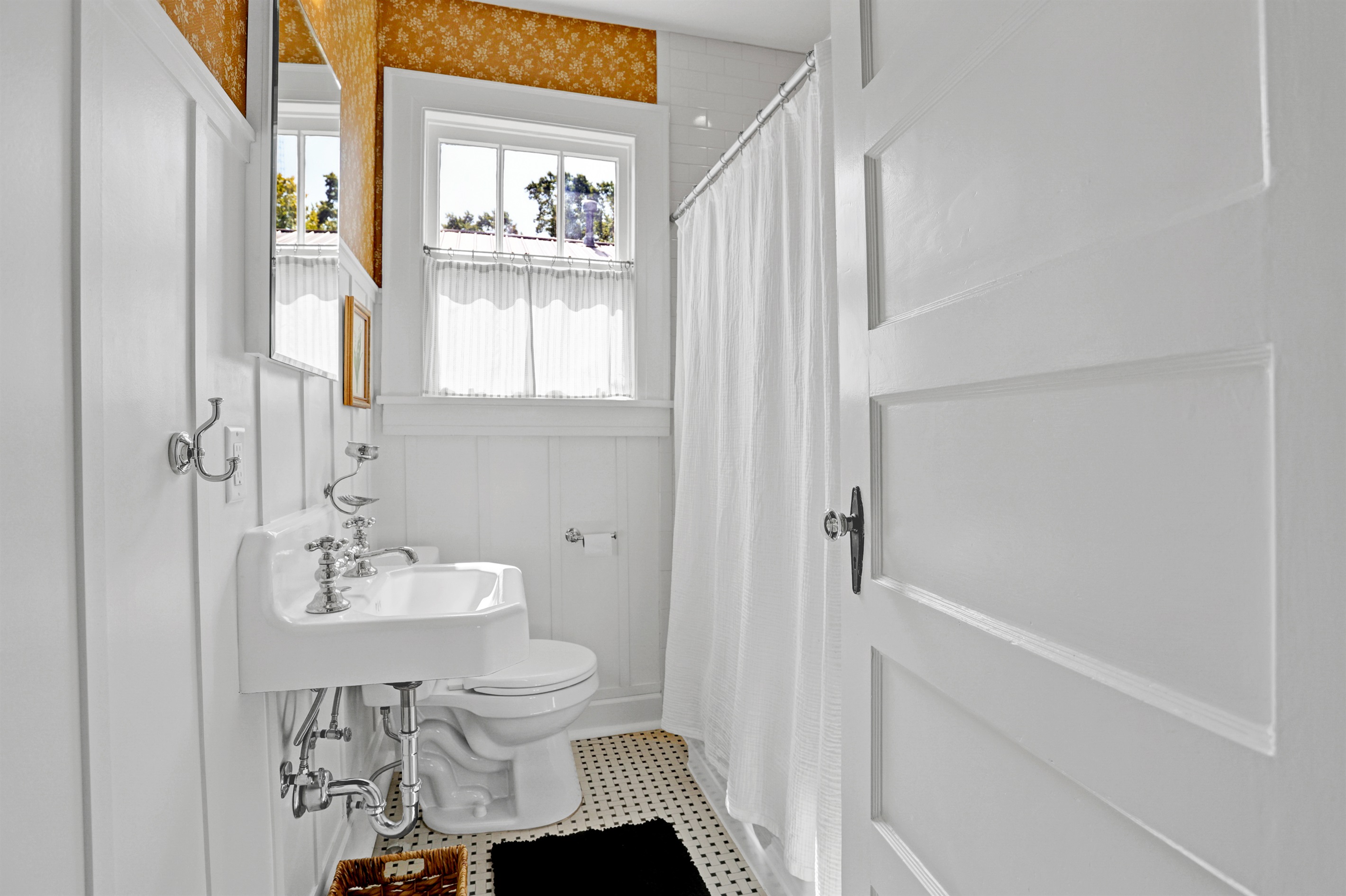 A perfect blend of classic style and modern amenities makes this full bath both functional and inviting.