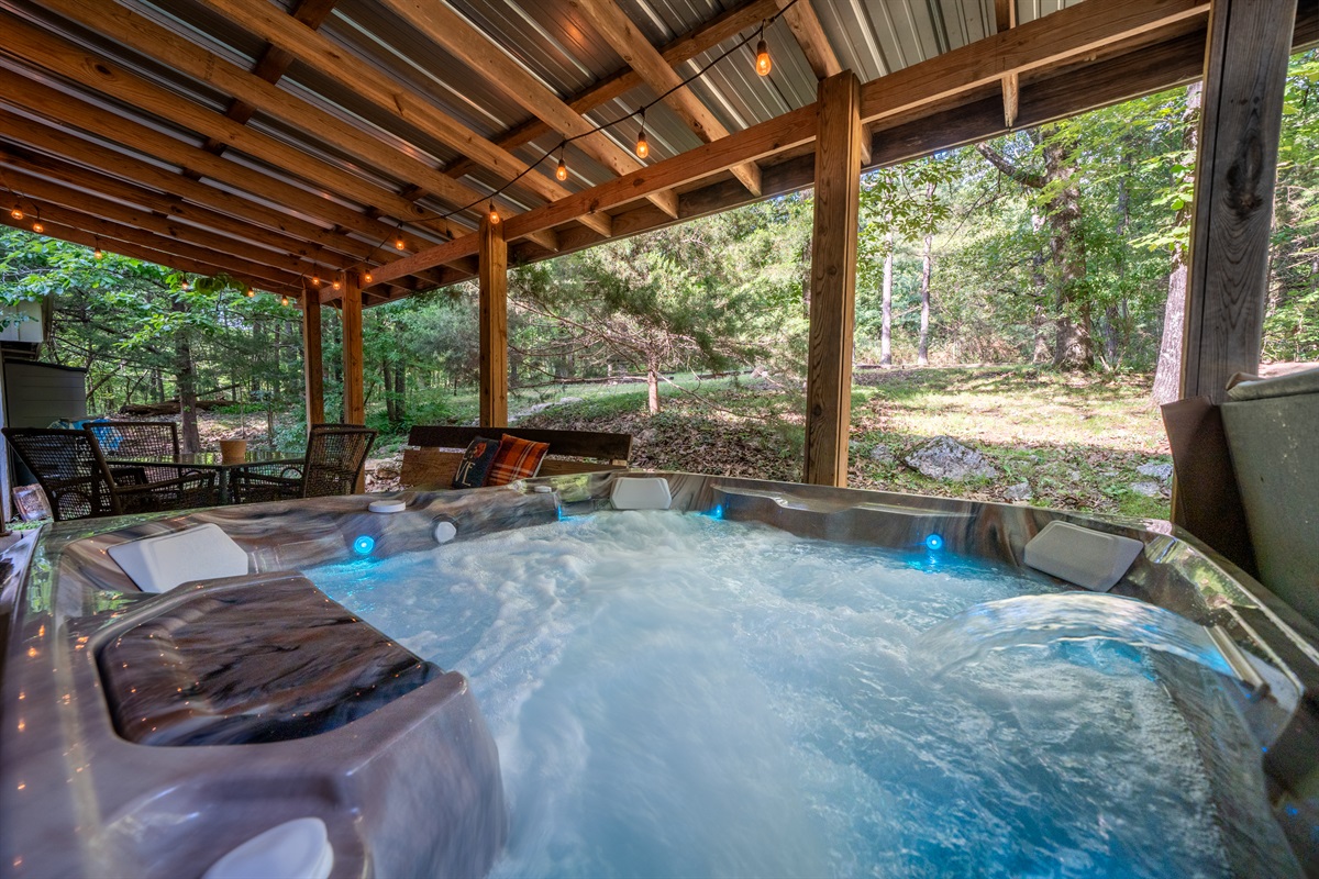 4-person hot tub on the tin-roofed back porch