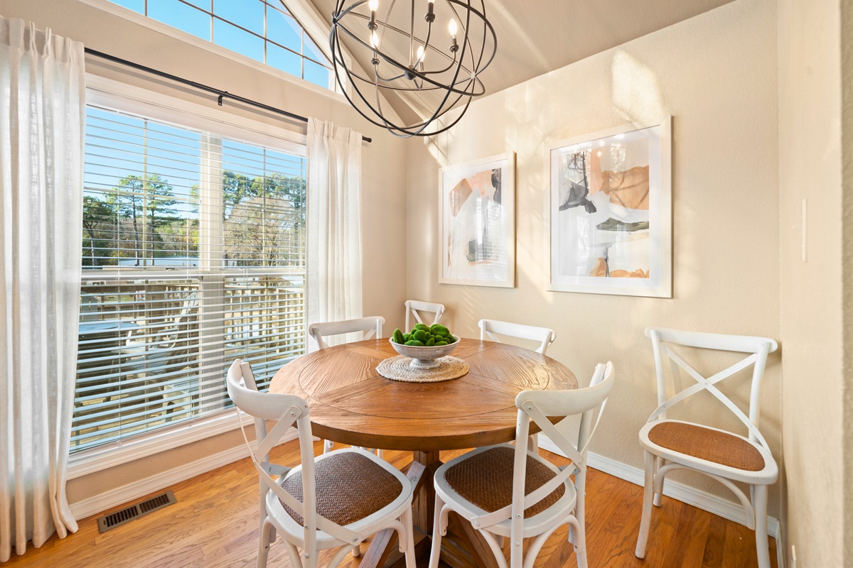 A closer look at the dining area shows how warm and welcoming it feels, perfect for shared meals or game nights.