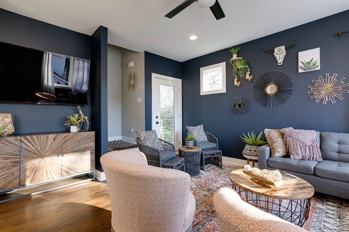 - Bright, artsy lounge where every seat is the best seat in the house - Wall art, cozy textures, & a splash of sunlight make it feel instantly welcoming - Whether you're streaming a movie or sharing laughs, this space is all about good vibes