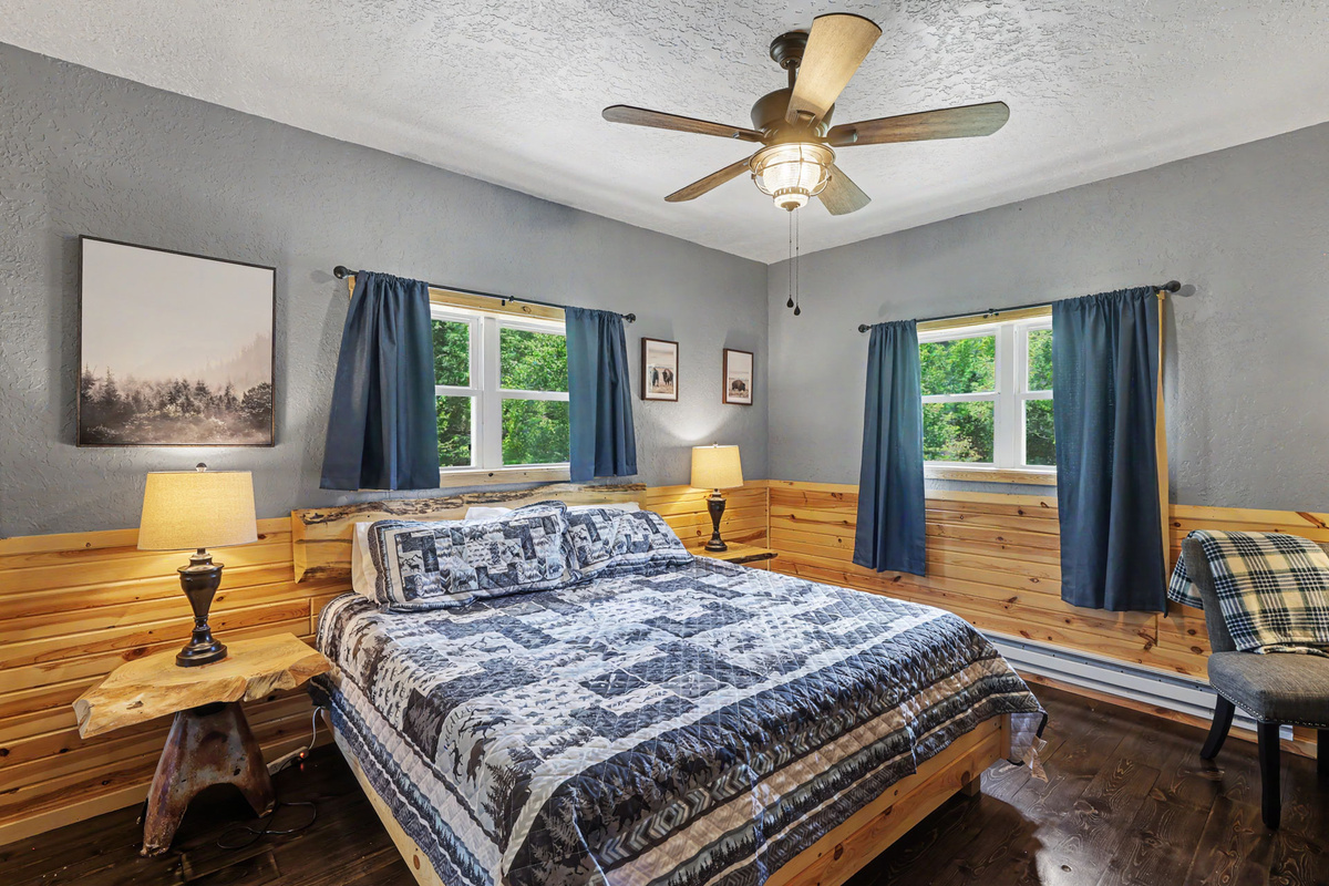 King Bed with view of the yard and stream