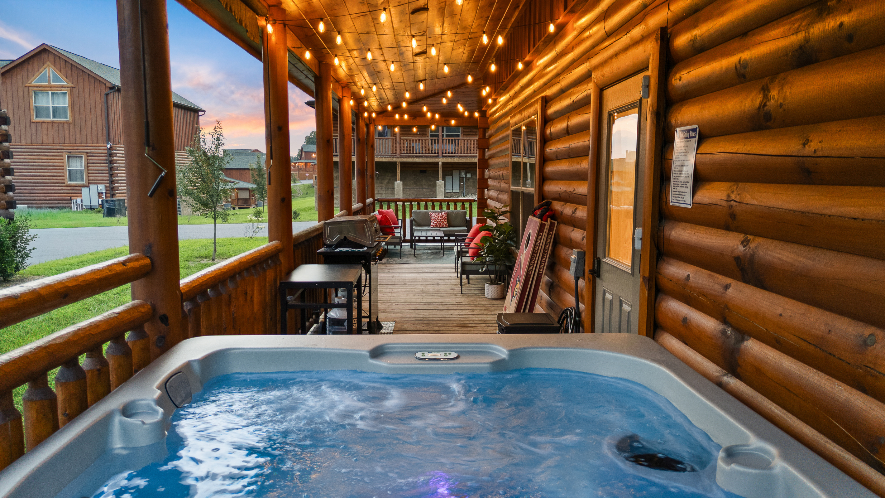 Relax in the hot tub located at the back of the cabin on the wrap around porch.