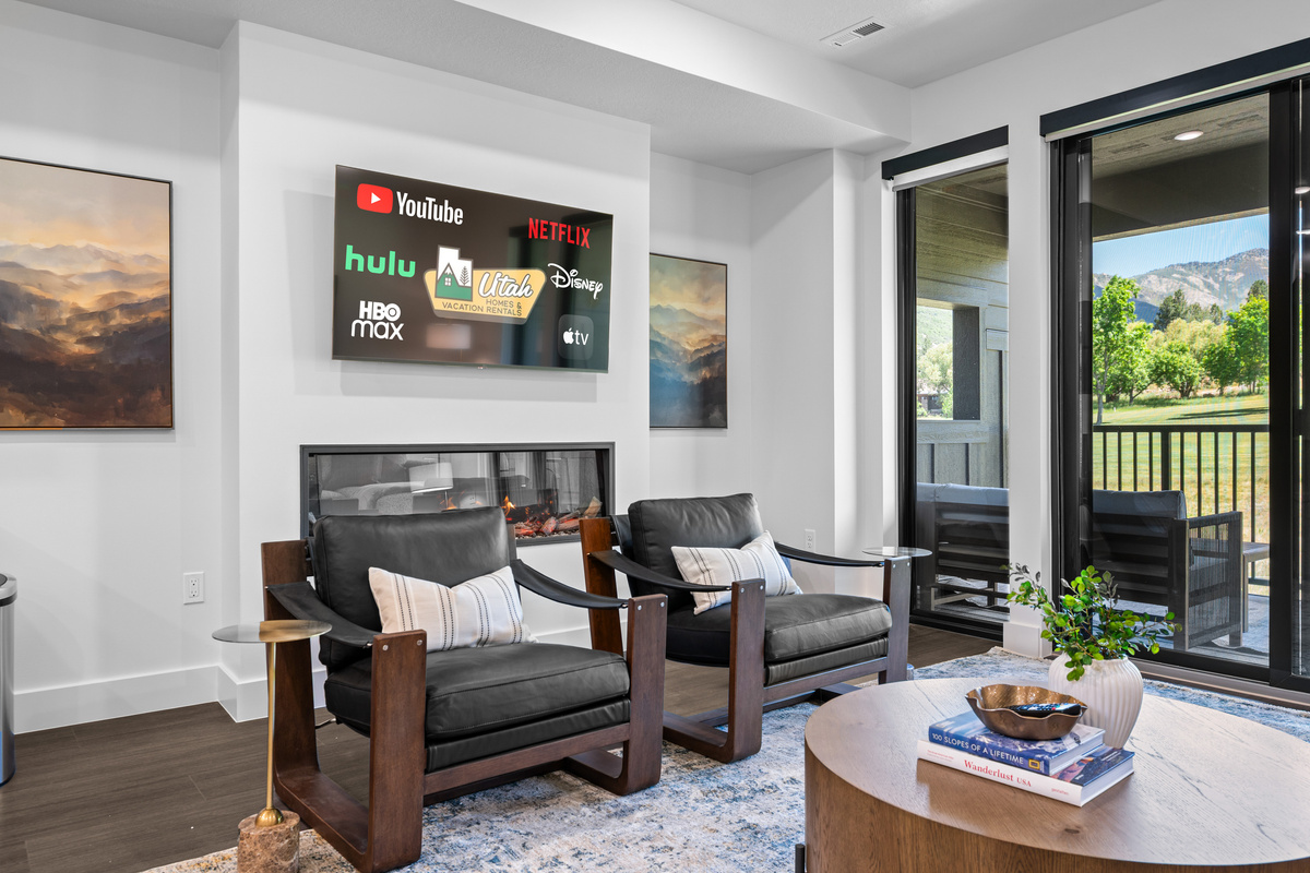 Cozy fireplace and Smart TV create the perfect evening retreat.
