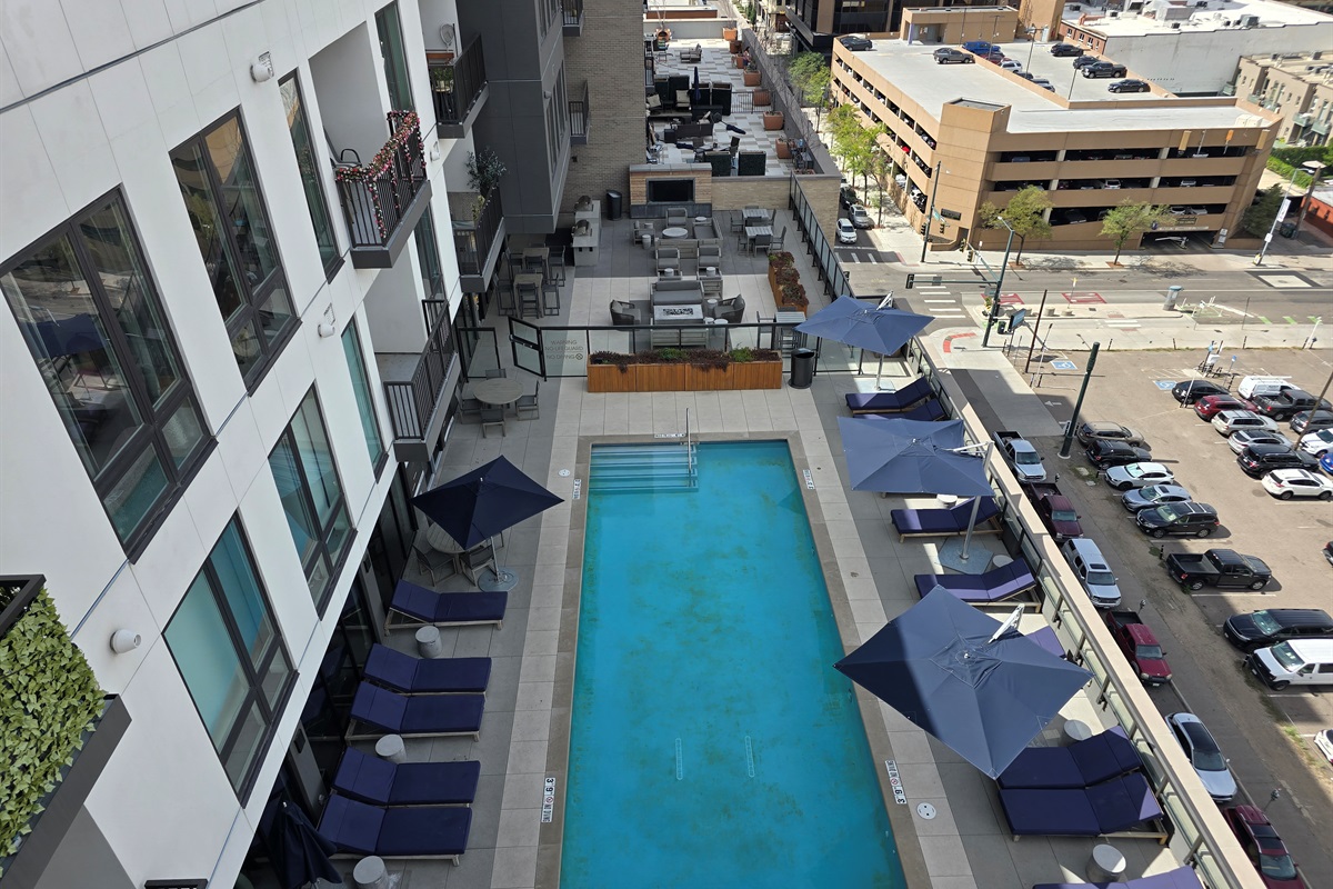 View of the pool area from the private balcony off of the main bedroom