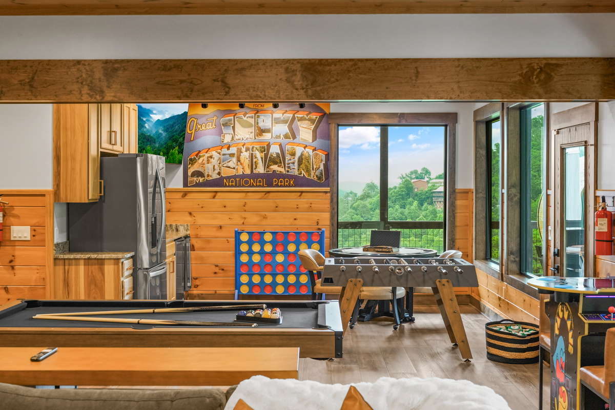 The perfect hangout after a day exploring the Smokies. Enjoy hours of fun with pool, shuffleboard, foosball & classic arcade tables plus a convenient kitchenette for snacks and drinks. This entertainment-packed space is designed for family fun, game nights