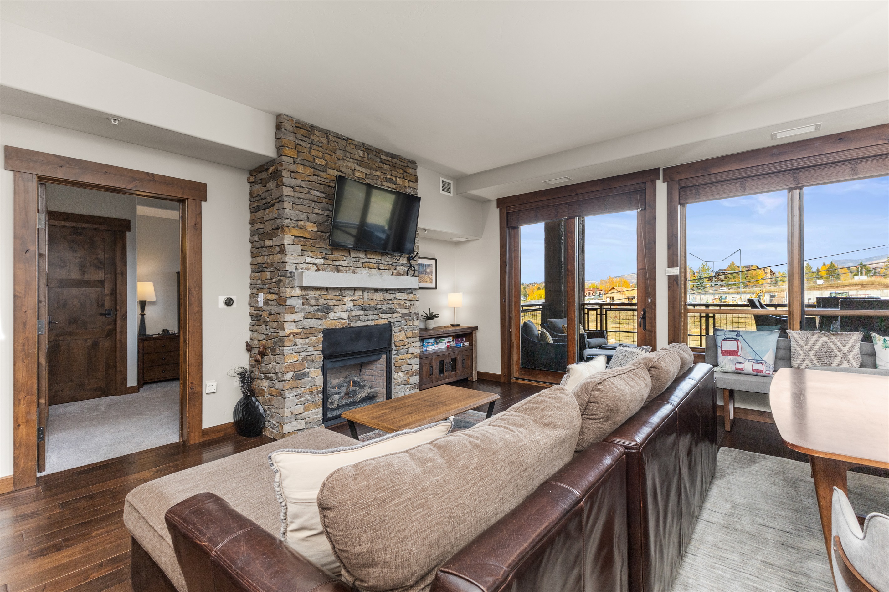 Living Room with Fireplace and View from Patio