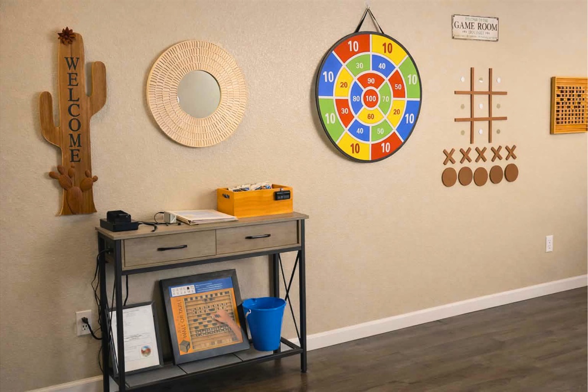 The living room has a custom game wall where your family can engage in some fun, friendly competition.
