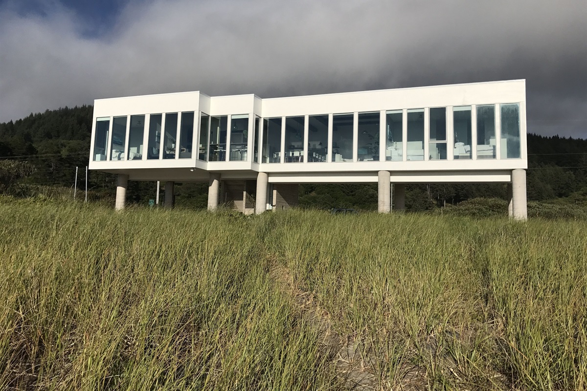 All glass West wall; Less than 50' walk to the sandy beach