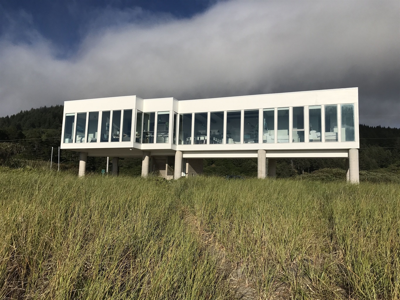 All glass West wall; Less than 50' walk to the sandy beach