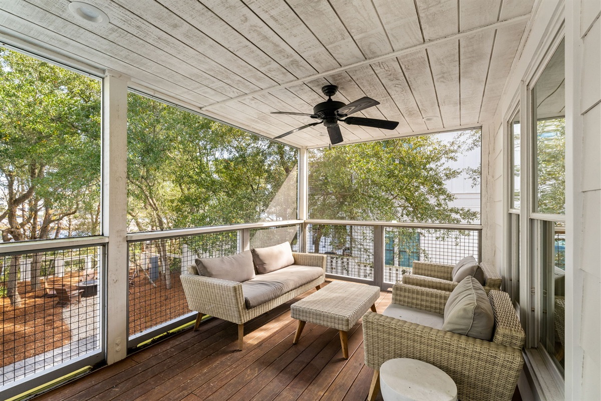 2nd Floor Back Deck: The perfect spot for morning coffee or sunset dinners. Our screened-in deck lets you enjoy the coastal breeze and lake views without the pests.