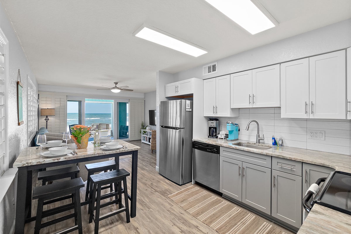 Modern kitchen with stainless appliances and beach views
