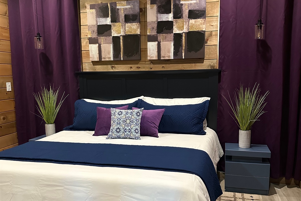 Rich tones, plush layers, and cozy lighting create a calming king retreat. Designed for restful nights and slow mornings, this inviting space wraps you in comfort after days spent exploring the mountains.
