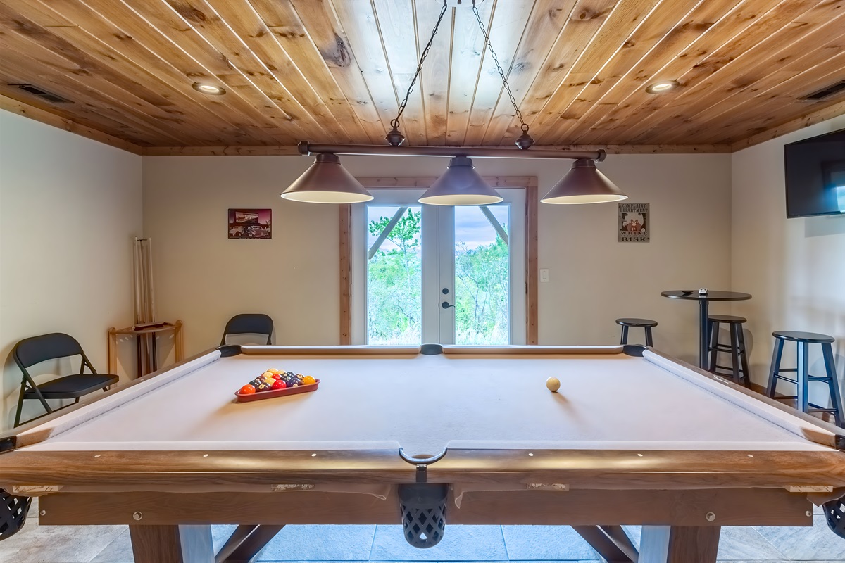 You'll never be bored in our lower level game room, which is complete with a ping pong table, pool table and TV.
