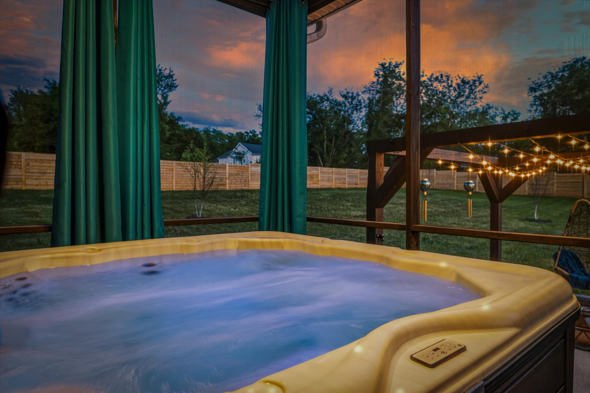 The hot tub offers a perfect place to relax after a day of exploring.   Covered, screened in, and draw the curtains for extra privacy.
