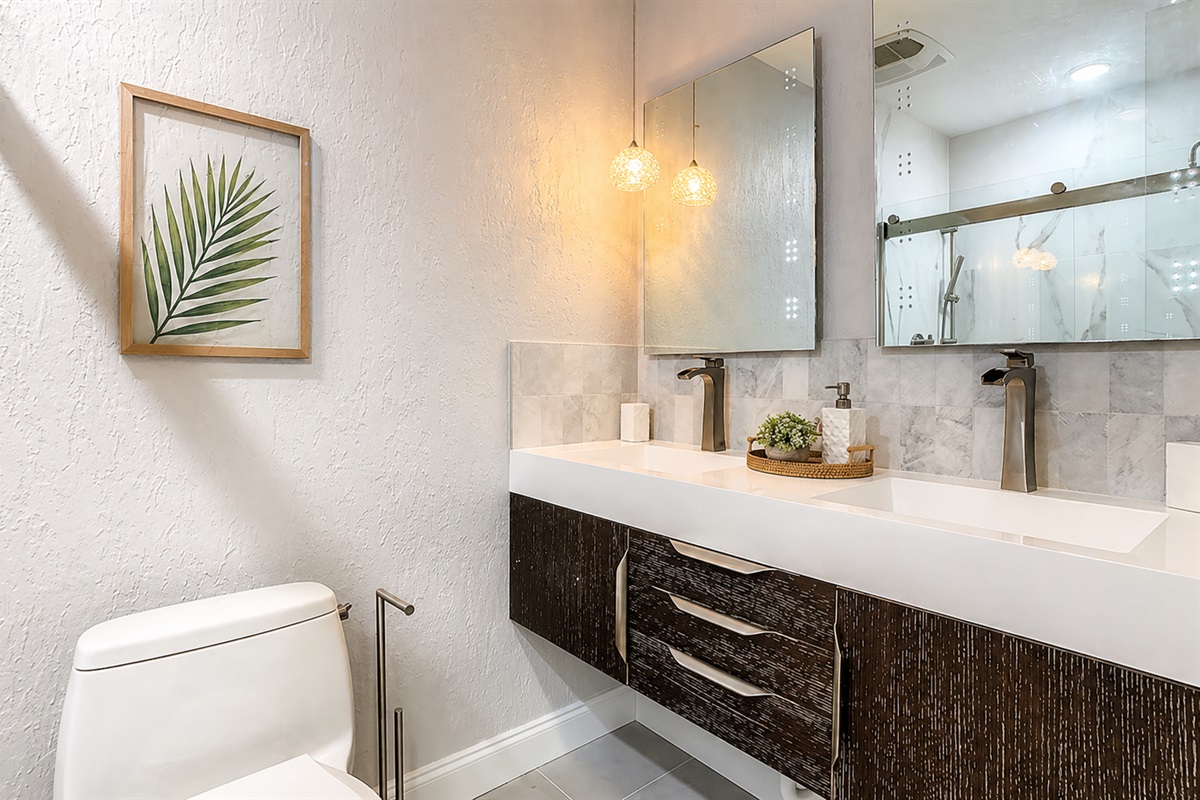 Spacious bathroom with large vanity, dual sinks and modern fixtures