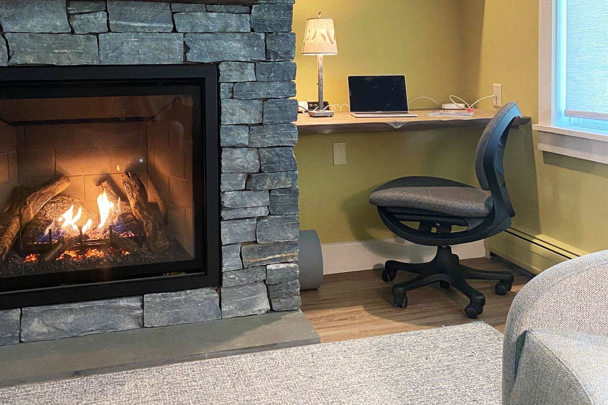 Warming gas fireplace is operable by remote and the built in workspace is complimented by a relatively strong streaming internet connection.