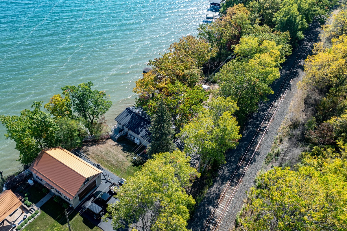 Peaceful lakeside retreat surrounded by lush trees—ideal for relaxing by the water