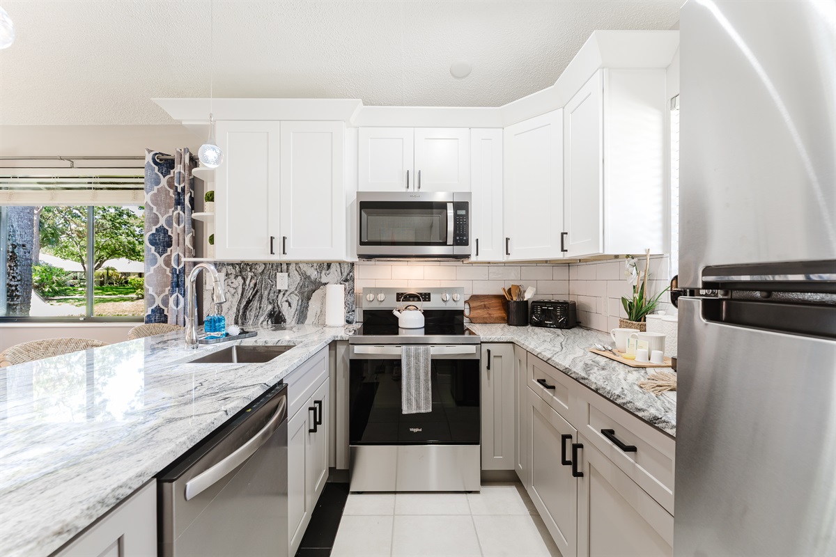 Fully upgraded kitchen with modern finishes, stainless steel appliances, and everything you need for cooking and entertaining at home
