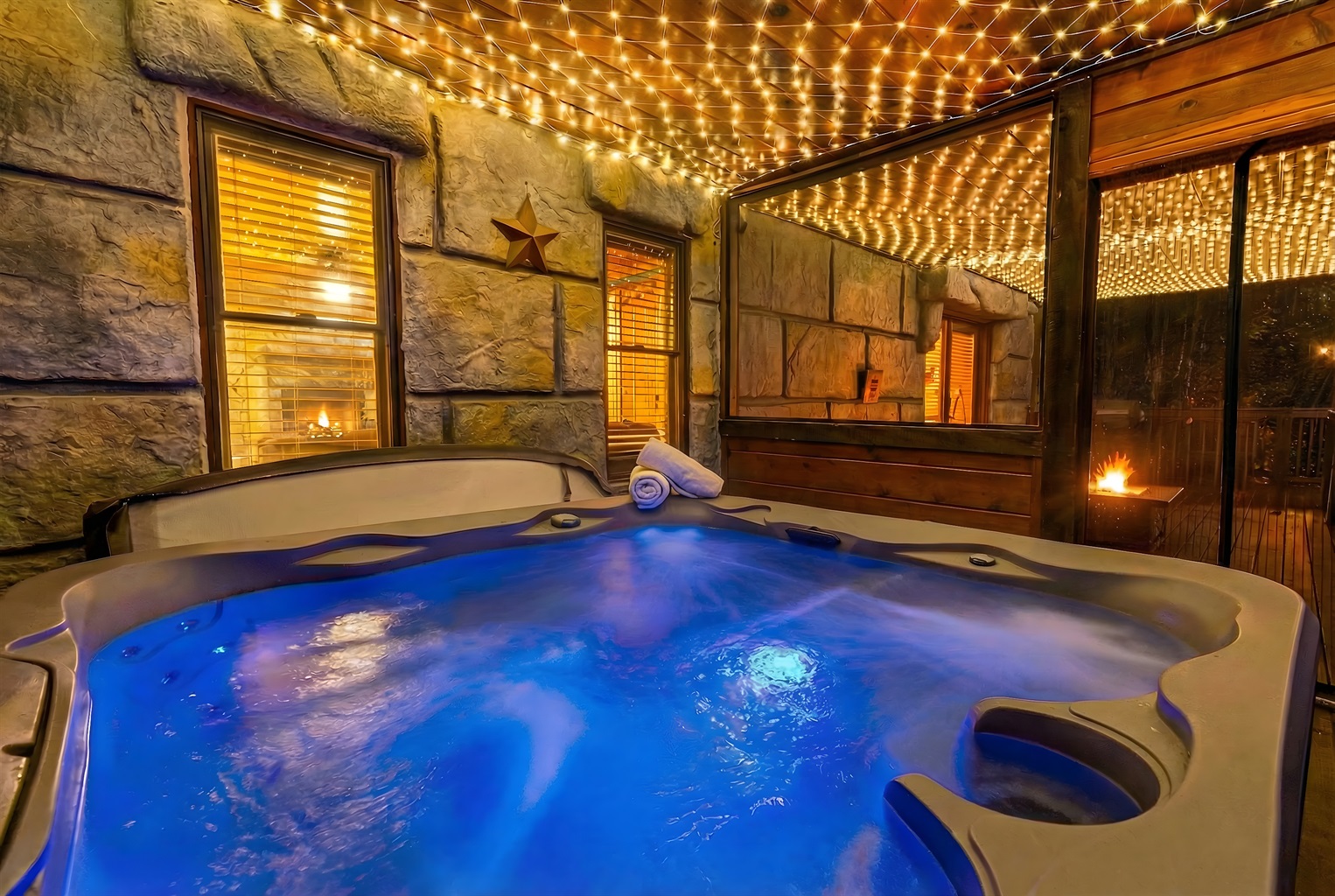 Private enclosed hot tub with screened windows. A perfect mixture of warm water, a light breeze, and the twinkle of lights