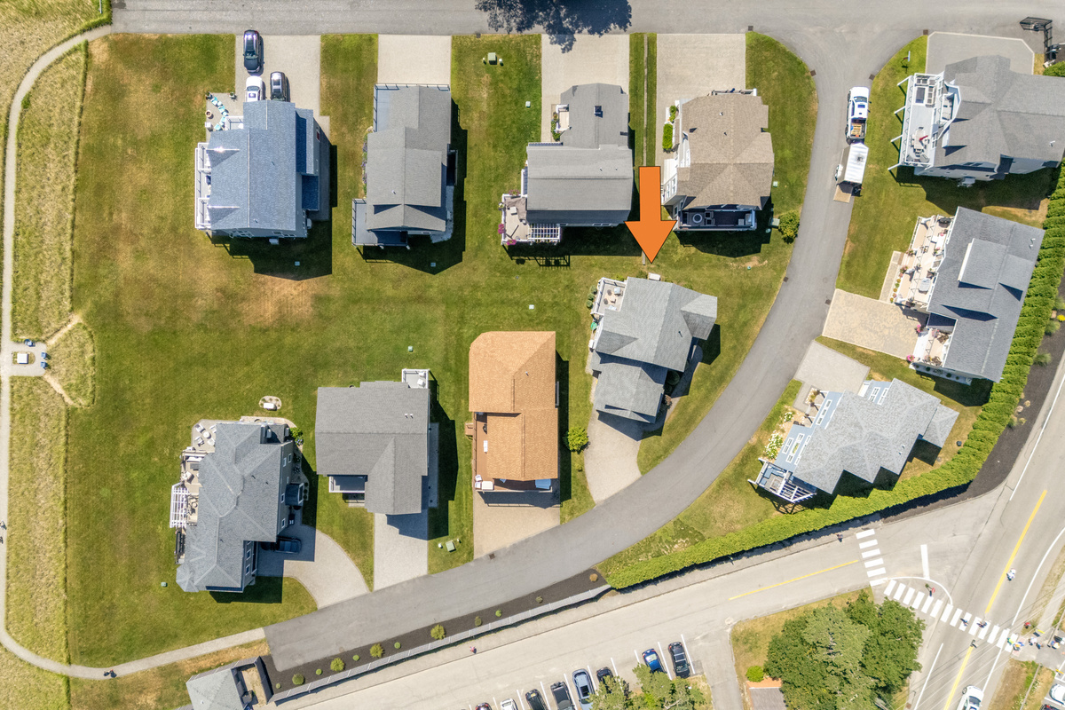 An aerial view highlights the home's location within this charming coastal neighborhood.