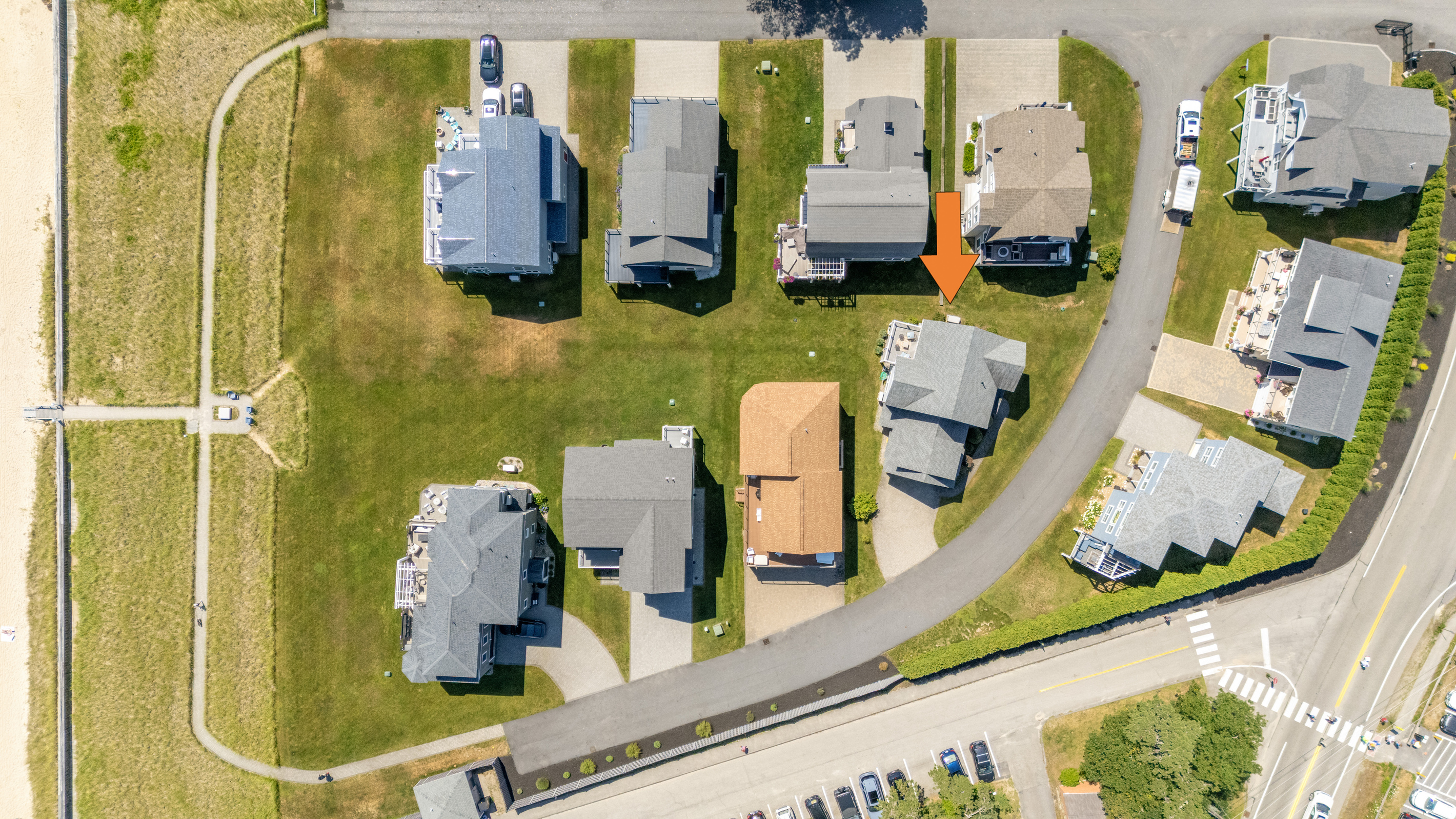 An aerial view highlights the home's location within this charming coastal neighborhood.
