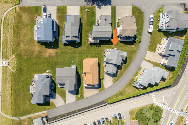 An aerial view highlights the home's location within this charming coastal neighborhood.