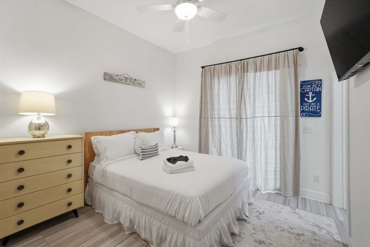 Private downstairs guest bedroom with queen bed