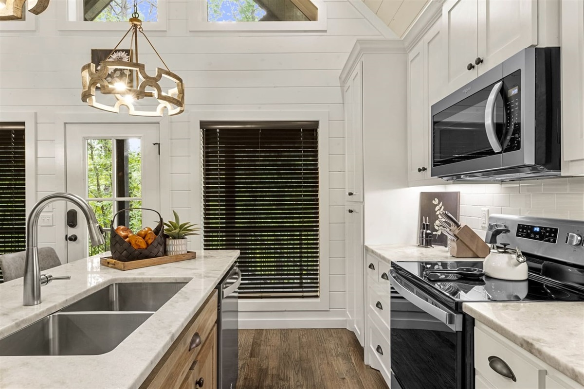 From morning coffee to gourmet dinners, this granite-accented kitchen with top-tier appliances has everything you need.
