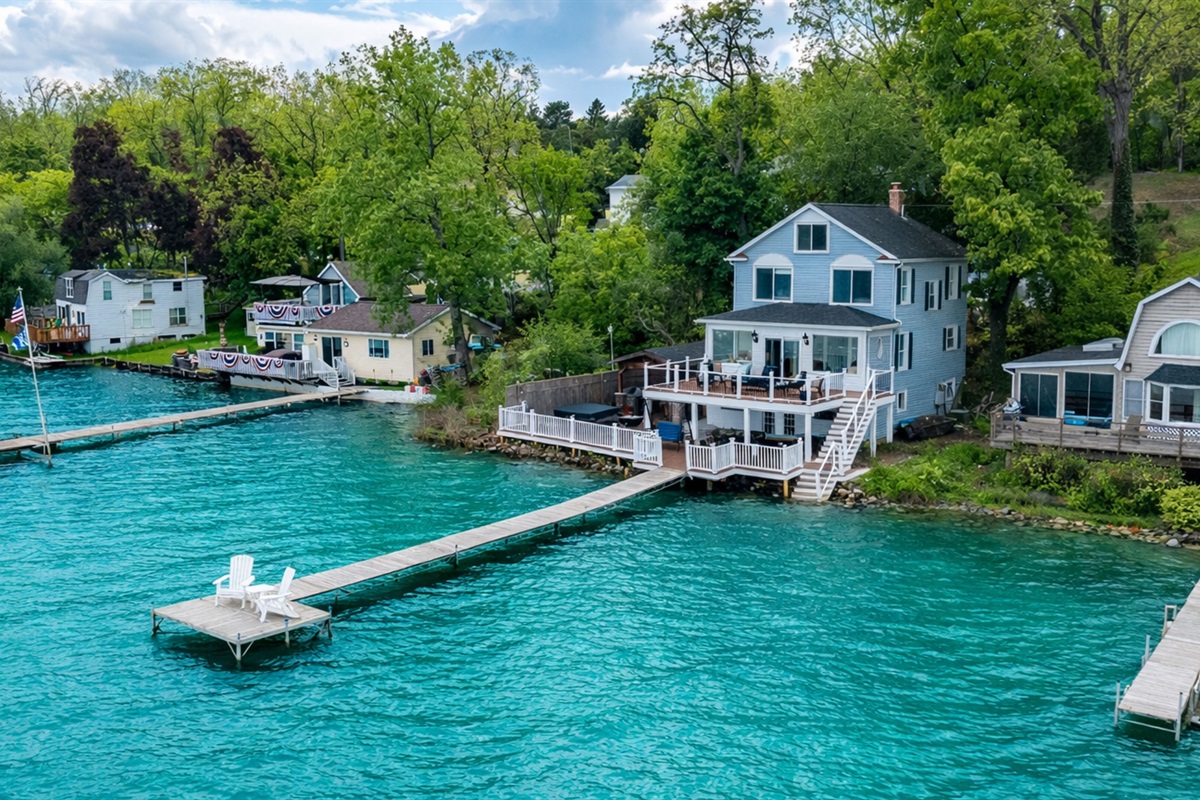 Stunning lakefront home with multi-level decks and a private dock—perfect for sunrise coffees and sunset cocktails 🌅🏡🚤
