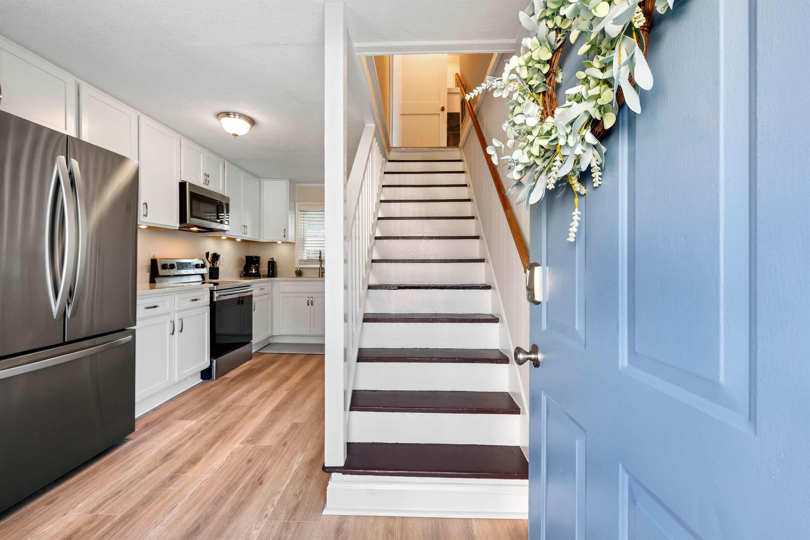 Entry with kitchen and stairs