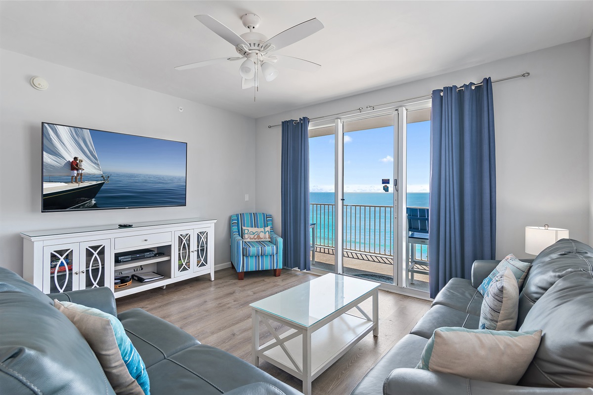 Comfortable, open living space with New Leather Sleeper Sofa and Love Seat, 65" Smart TV, Gulf Views, Balcony Access