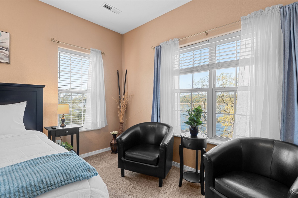 The primary bedroom even has a sitting area with lots of natural light