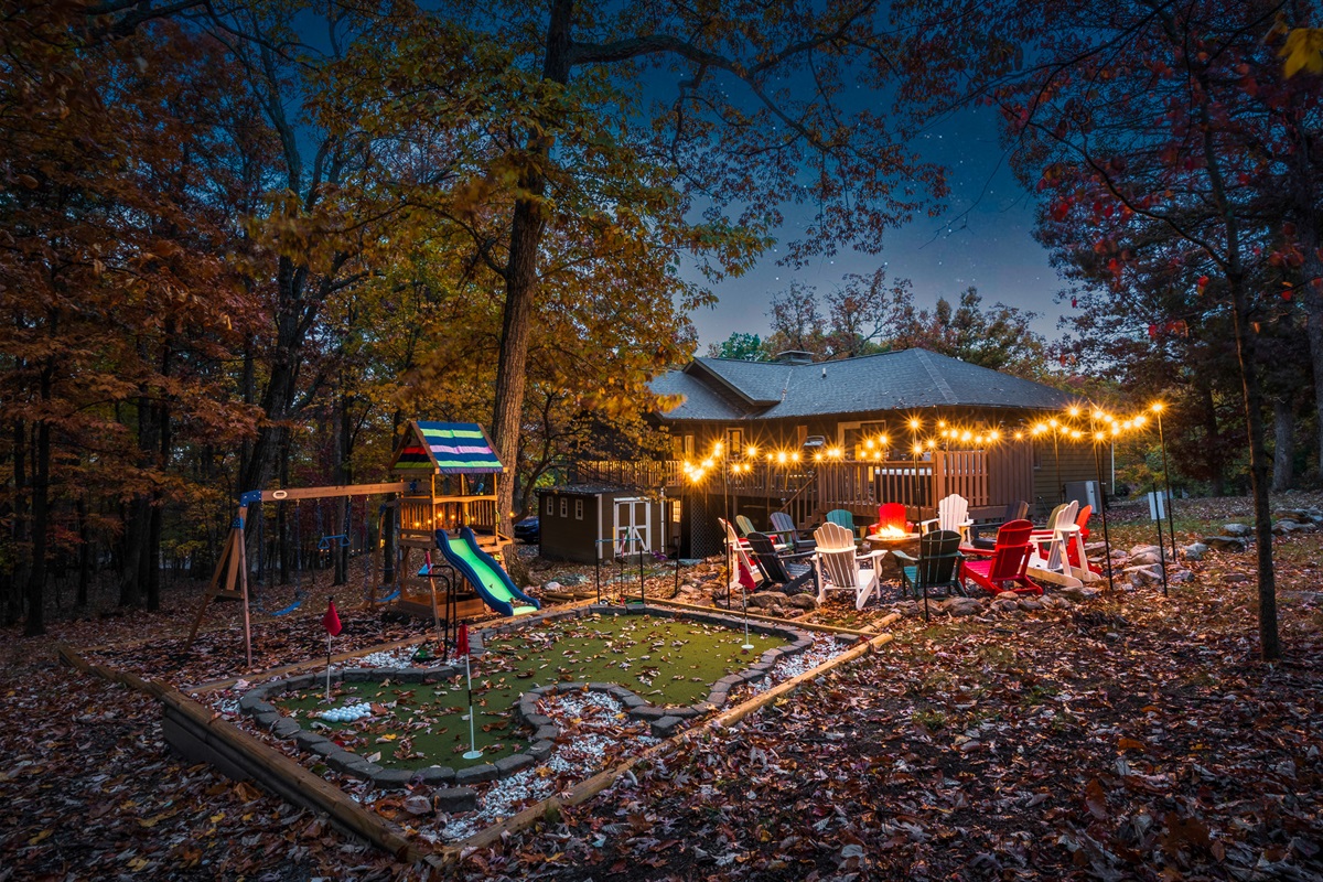Nights here feel magical — twinkle lights, a glowing fire, mini golf, and the woods all around you. This is where the memories happen