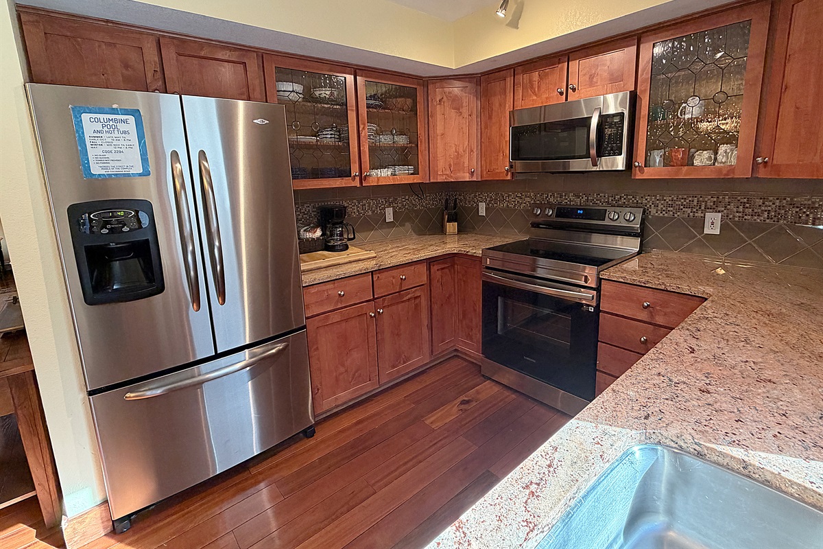 Kitchen with new appliances and view to hot tub.