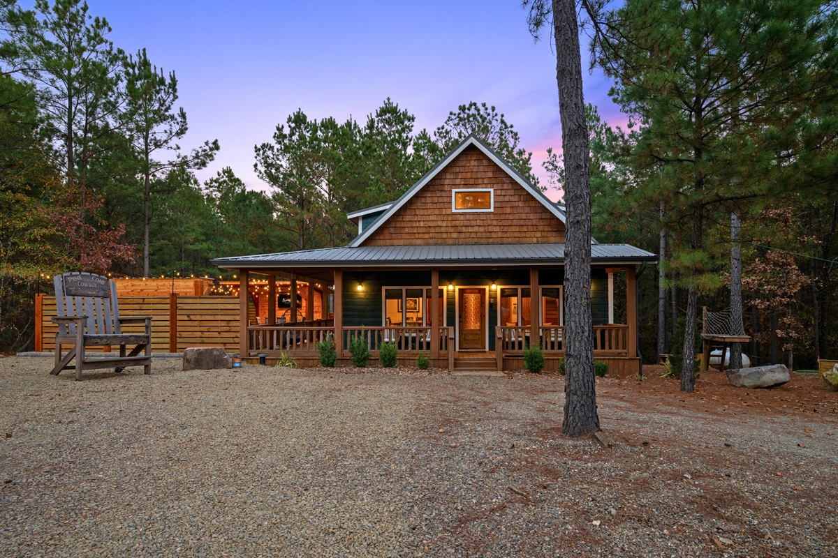 Welcome to your home away from home. This charming cabin nestled in the woods awaits you.