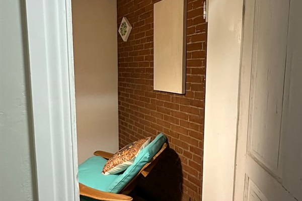 enclosed porch room lovely area to sit and read and have morning coffee