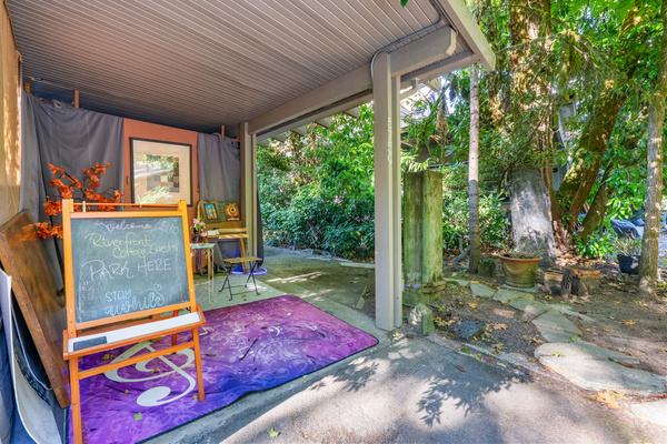 The covered art nook — paint, write, or just watch the river.
