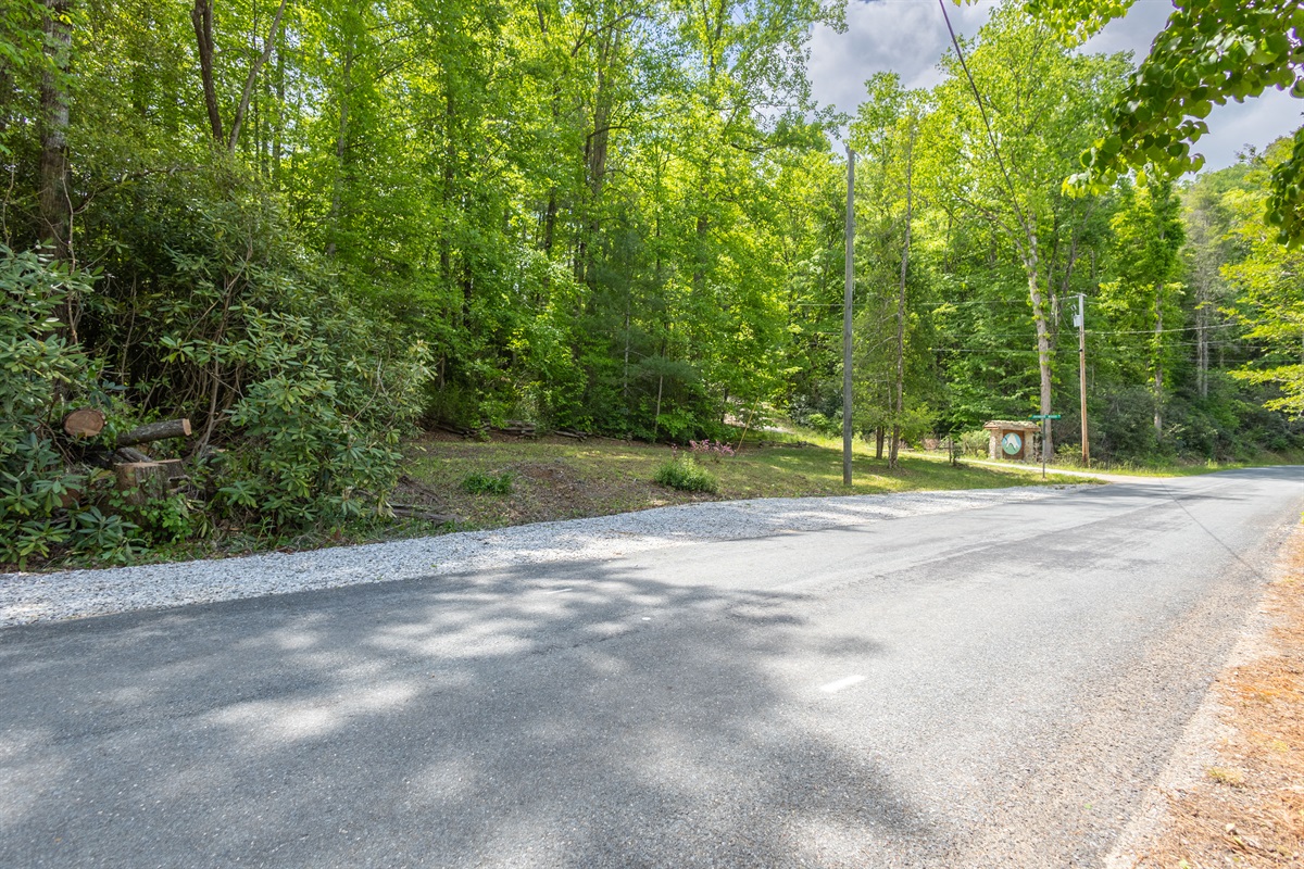 The additional parking area across from the cabin provides flexible space for larger groups or outdoor adventure gear